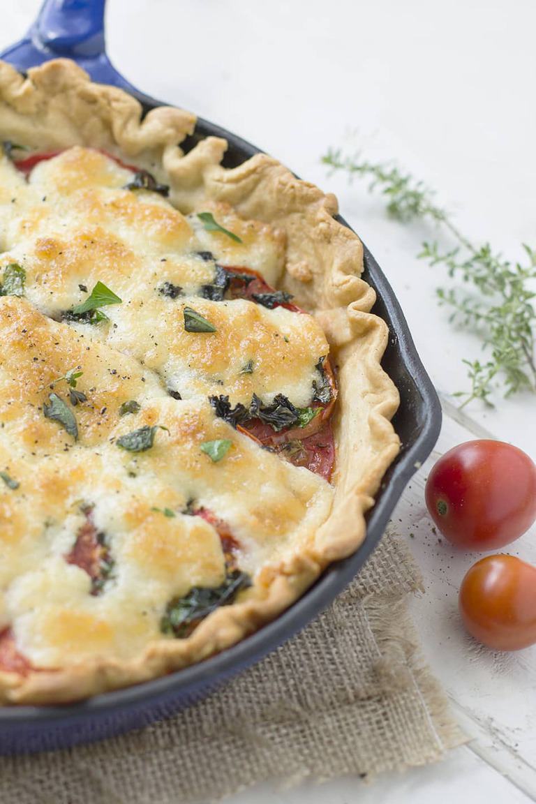 What is an easy tomato pie? One clue: it's not a pizza. It's summer. In a pan. Baked in the oven. It's summer love.