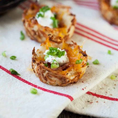 Loaded hash brown potato skins take away all the messy baking, scraping and remaking of a traditional potato skin and make it simple, affordable and tasty!