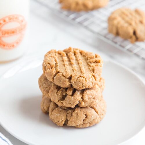 a stack of almond flour peanut butter cookies on a plate