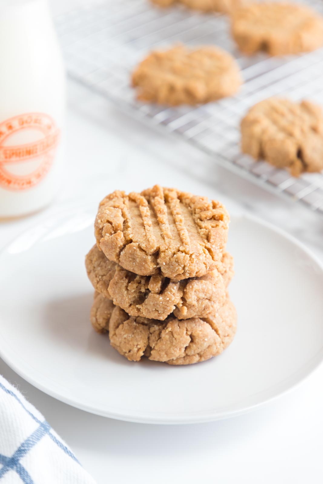 a stack of almond flour peanut butter cookies on a plate 