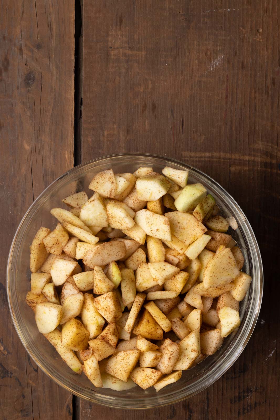 a bowl of diced apples and pears tossed with cinnamon and spices