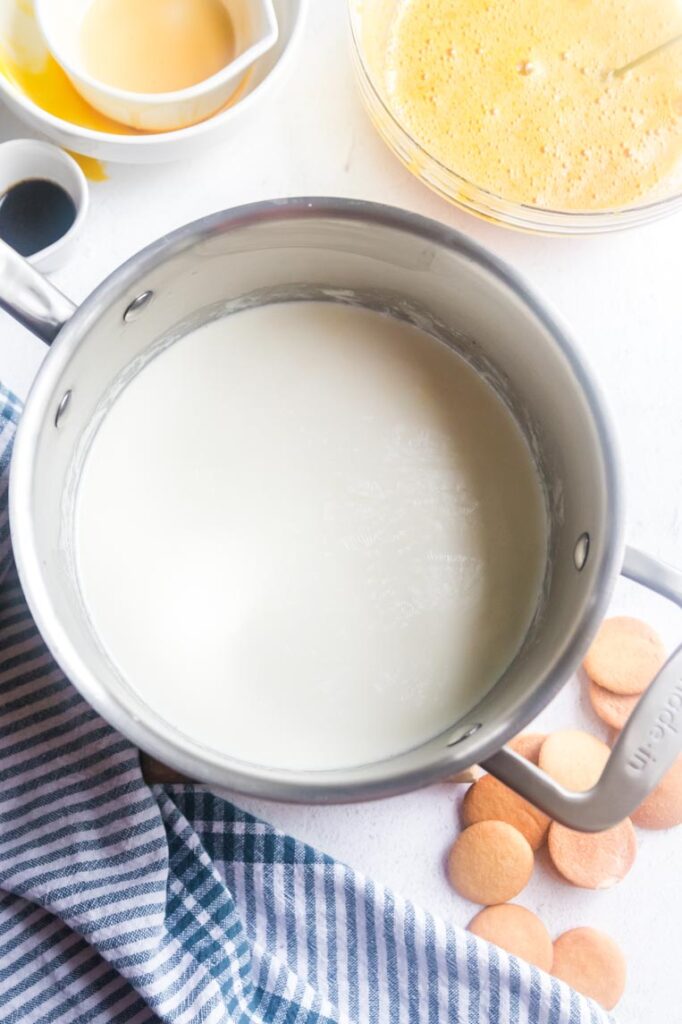 a pot with hot milk and cream