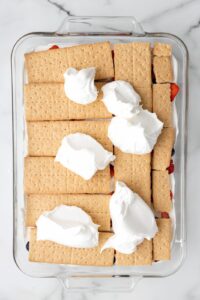 cool whip on layer of graham crackers