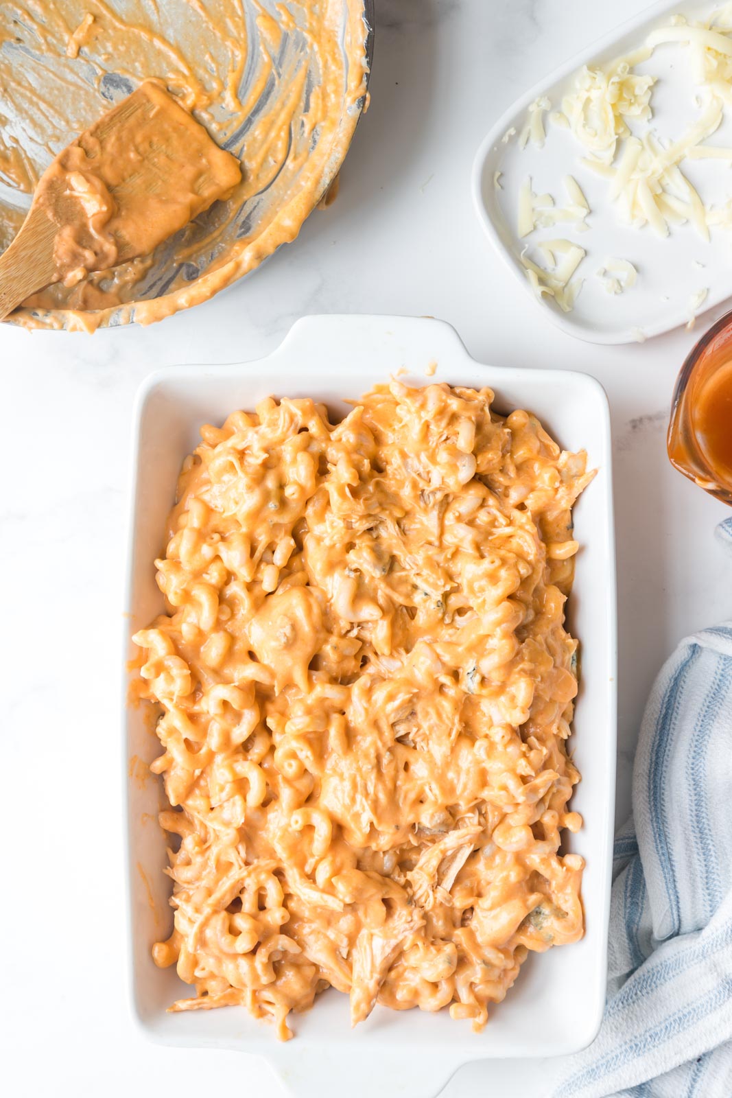 unbaked buffalo mac and cheese in a baking dish 