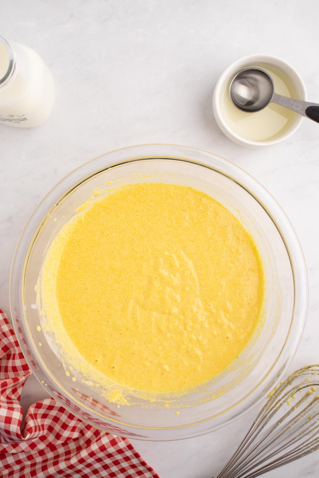 Cornbread cake batter in a mixing bowl.