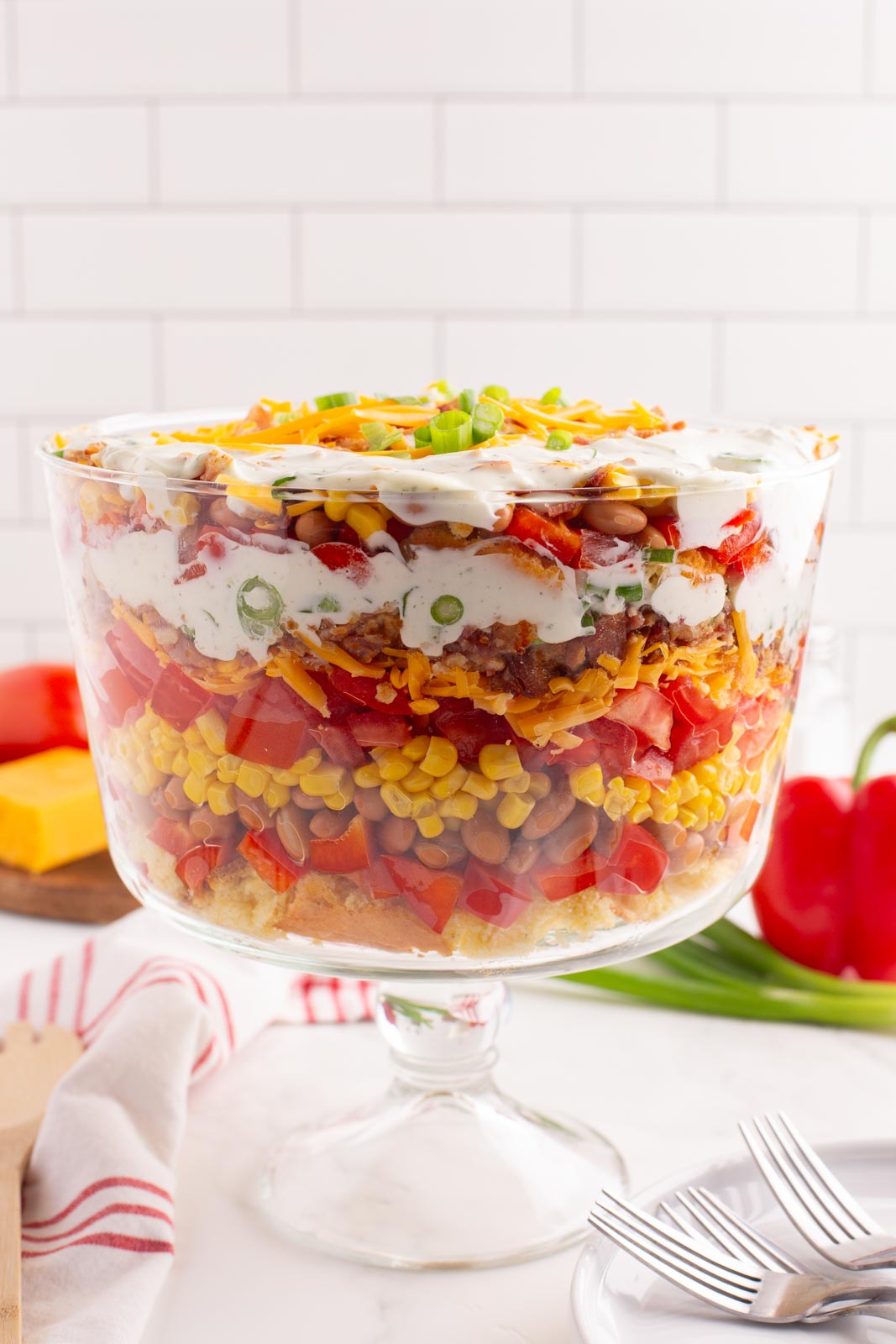 Cornbread salad in a trifle dish ready to toss and serve.
