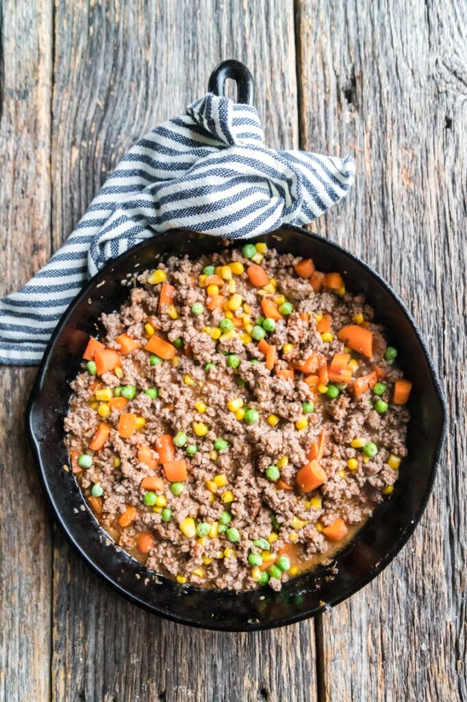 A skillet of beef filling for cottage pie 