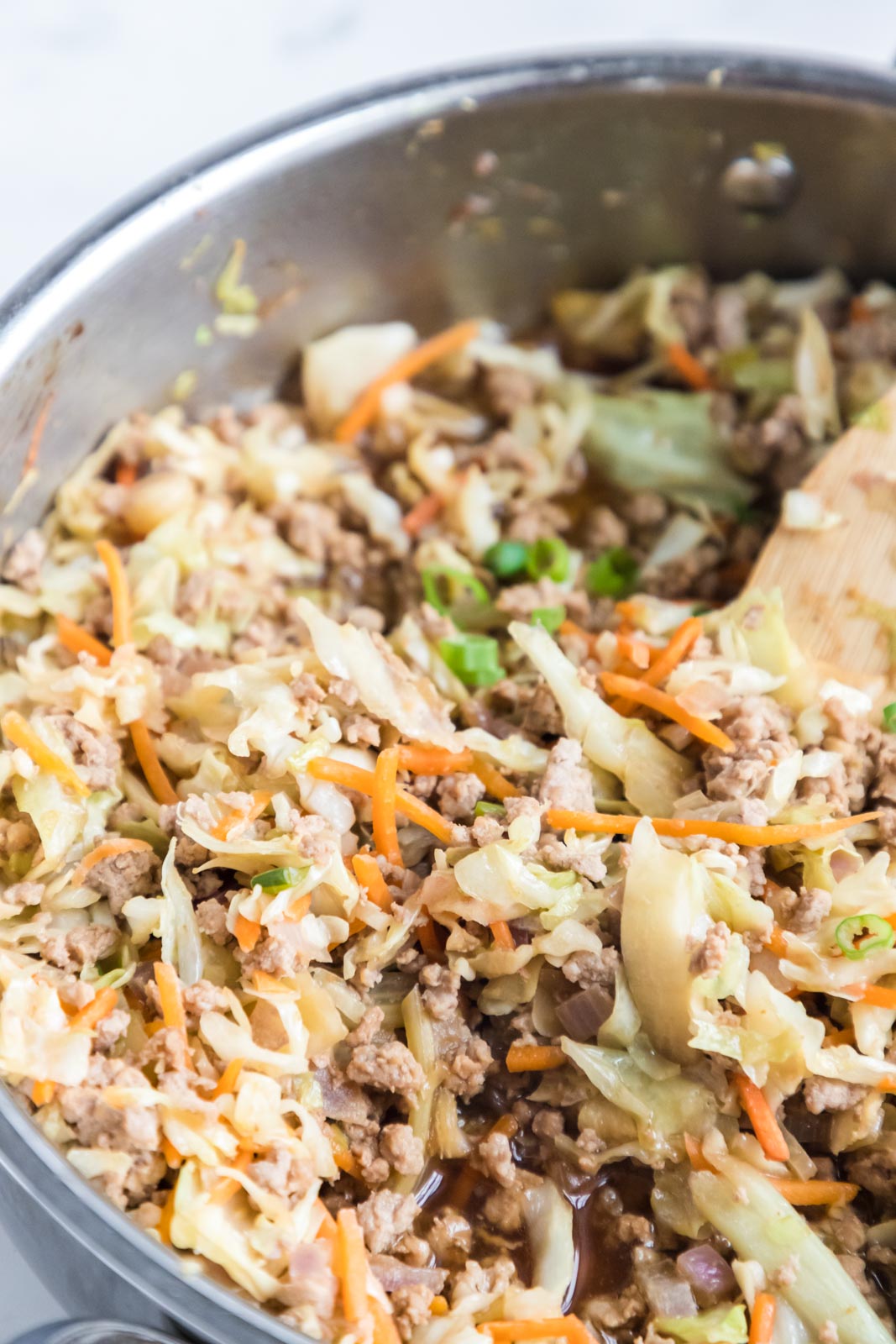 a close up of egg roll in a bowl in a skillet 