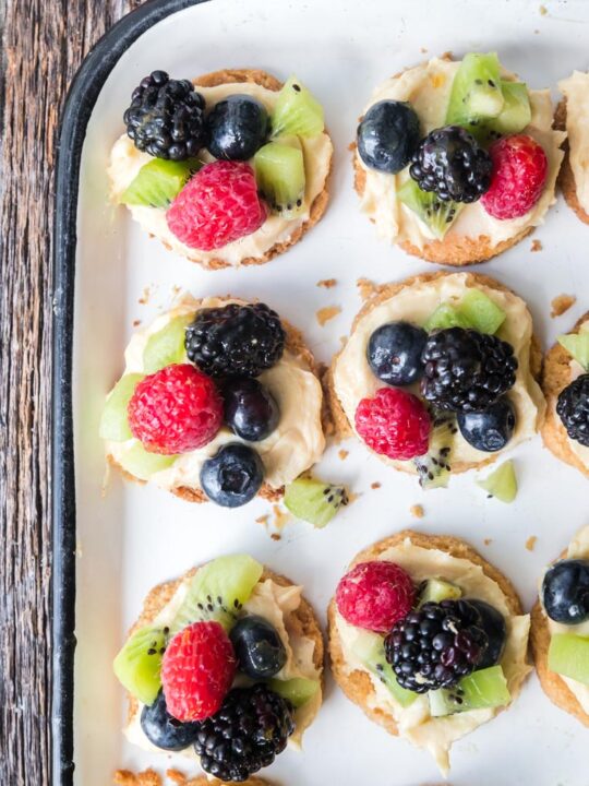 a tray of fruit pizza cookies on a tray