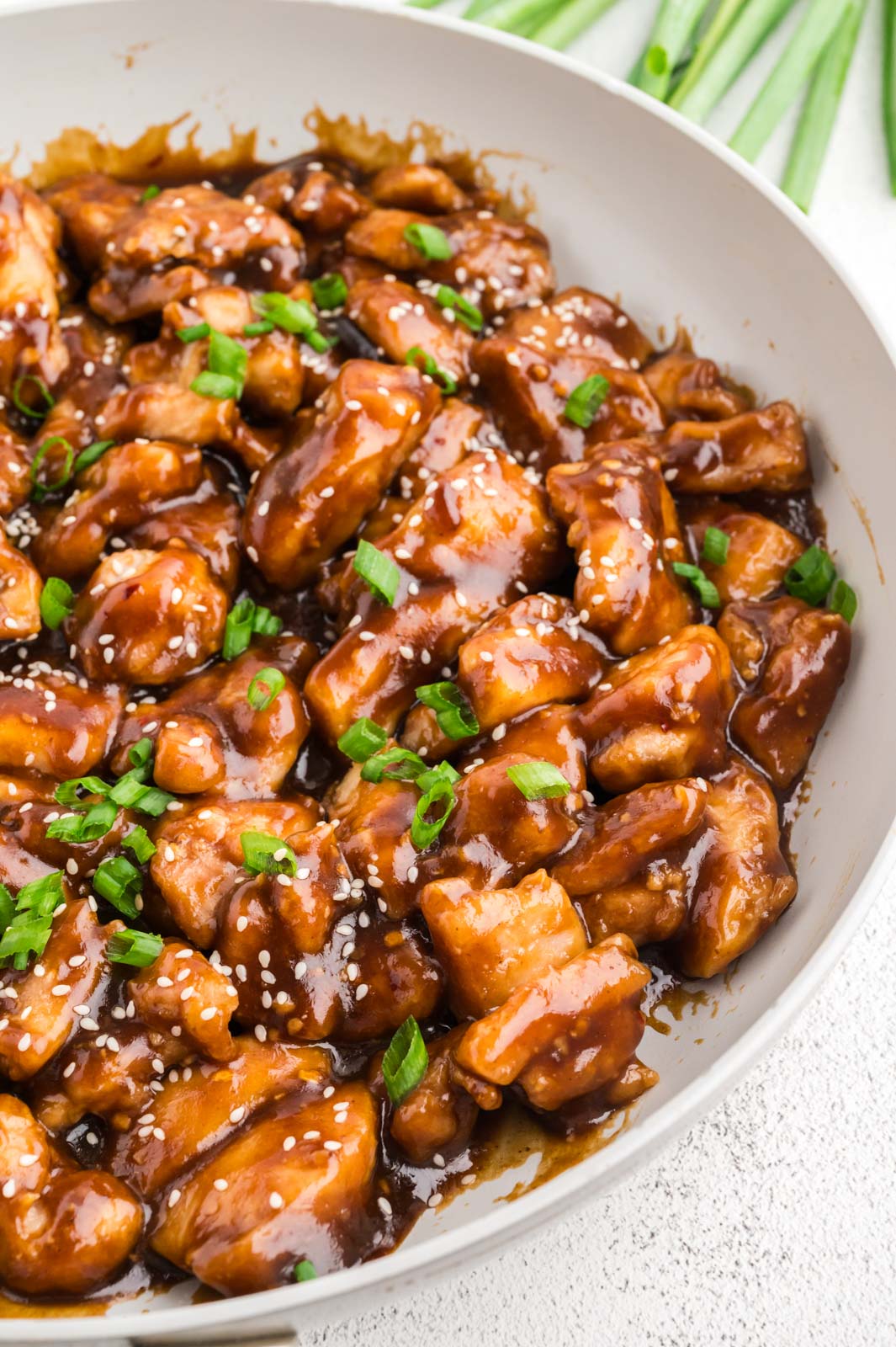 a bowl of general tso's chicken on a table
