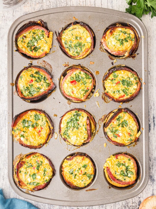 A 12 cup muffin tin with baked egg muffin cups.