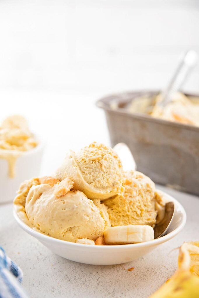 a bowl with three scoops of banana pudding ice cream 
