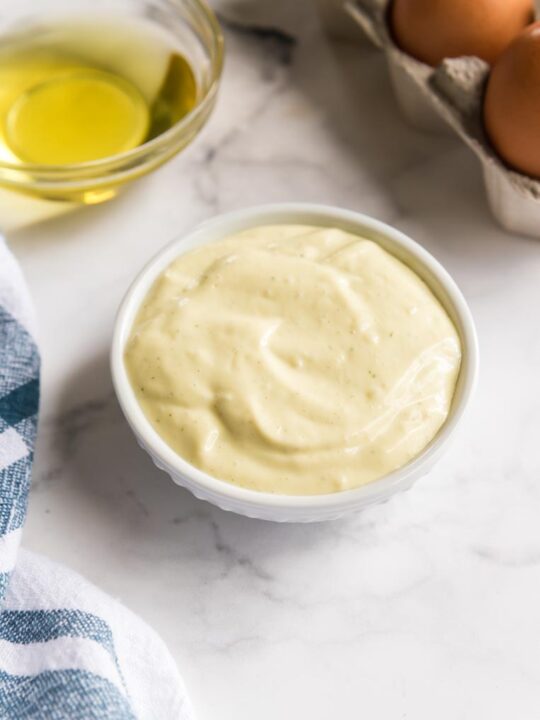a bowl of mayonnaise with eggs and oil
