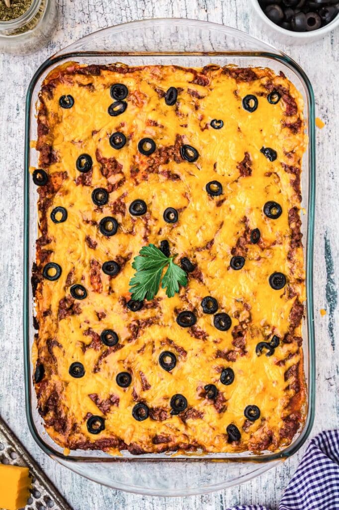 A 9 by 13 pan of baked Mexican lasagna 