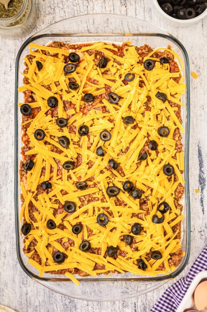 9x13 pan with repeated layers of meat sauce and cheeses