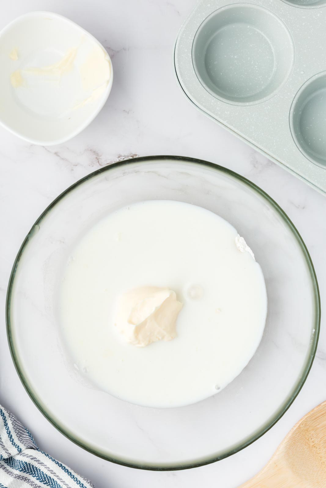 a bowl of milk and mayonnaise on a table