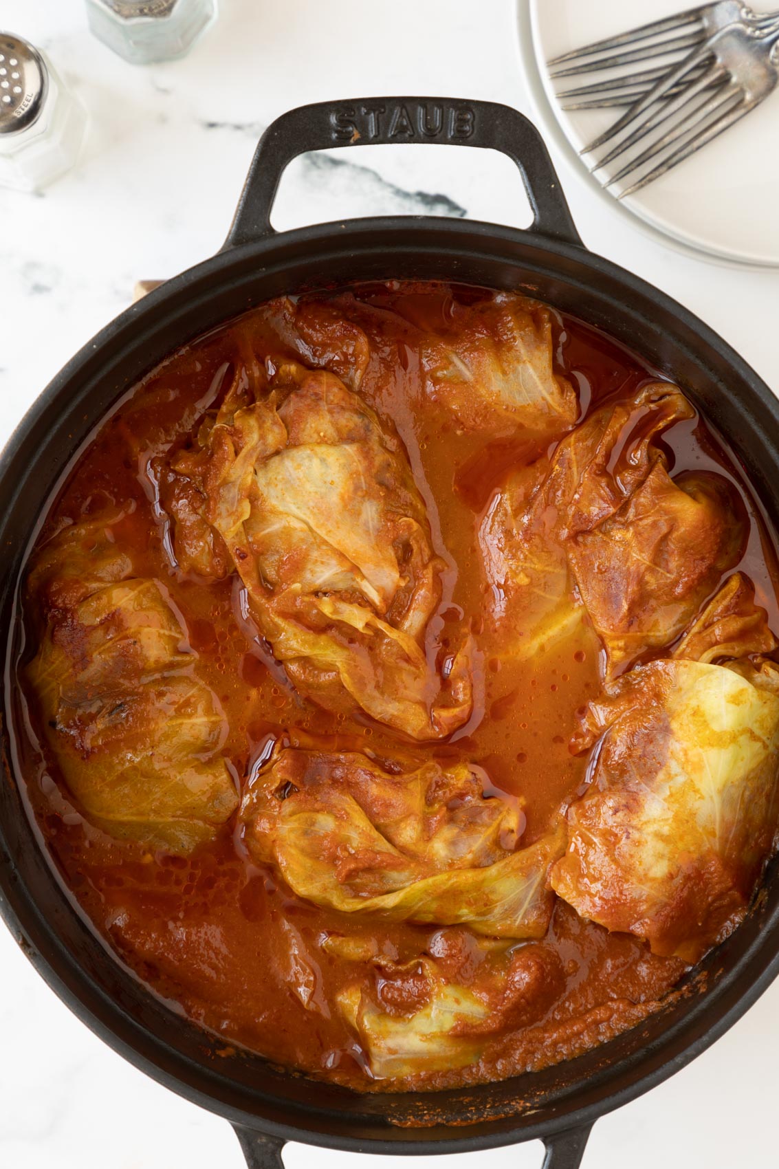 a pot of cooked cabbage rolls