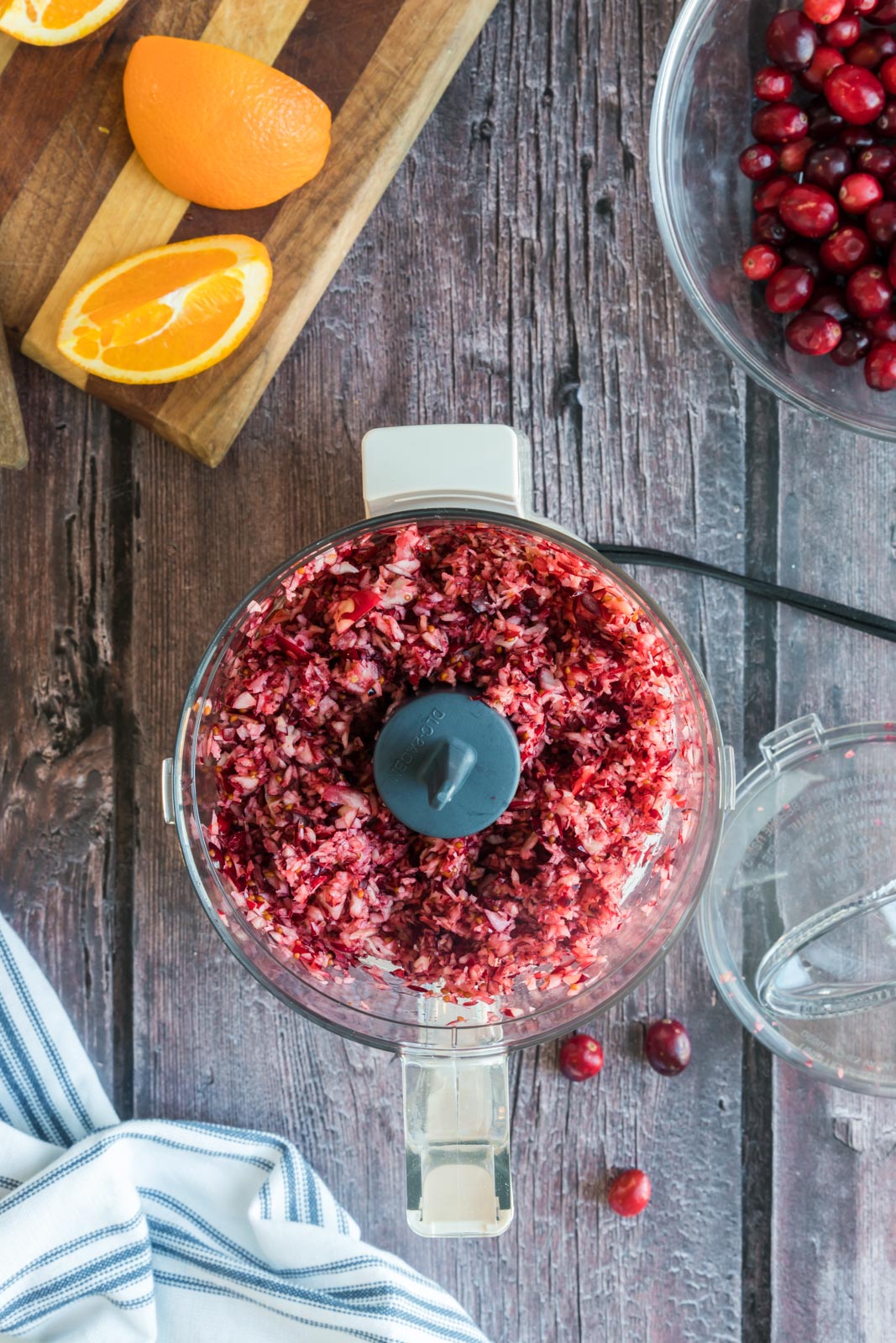 a food processor with chopped cranberries