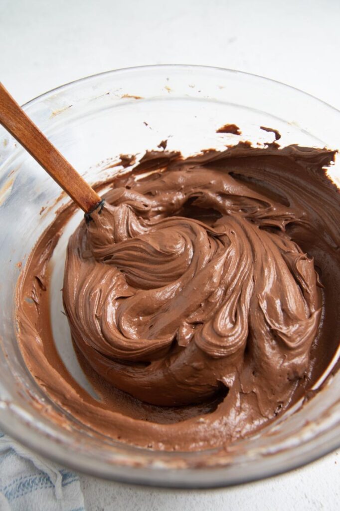 chocolate frosting in a bowl with a spatula 