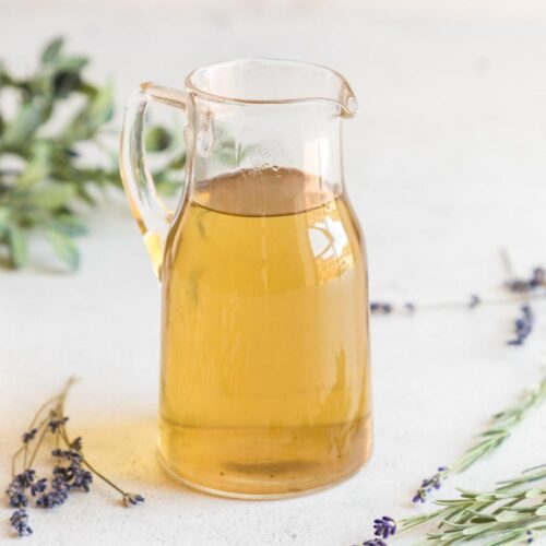 Lavender syrup in a pitcher.