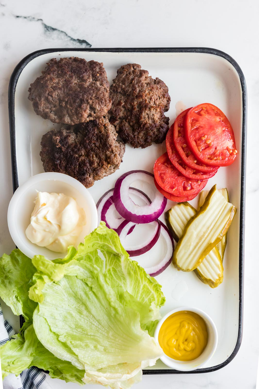 ingredients for low carb hamburgers on a tray