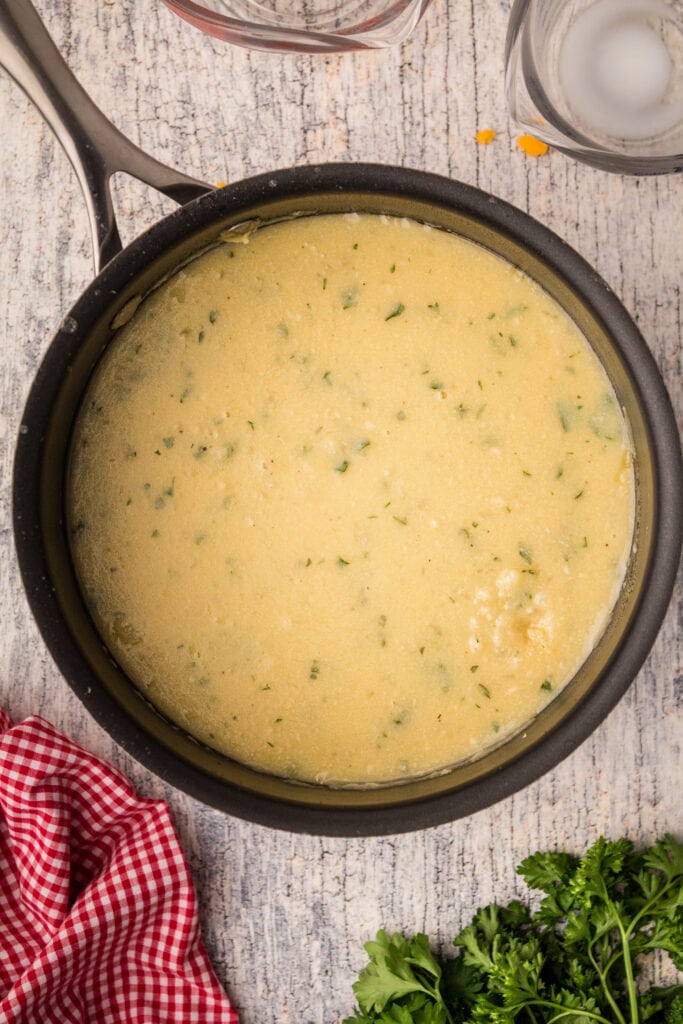 A pot of soup that has been heated to melt the cheese and blend all ingredients 
