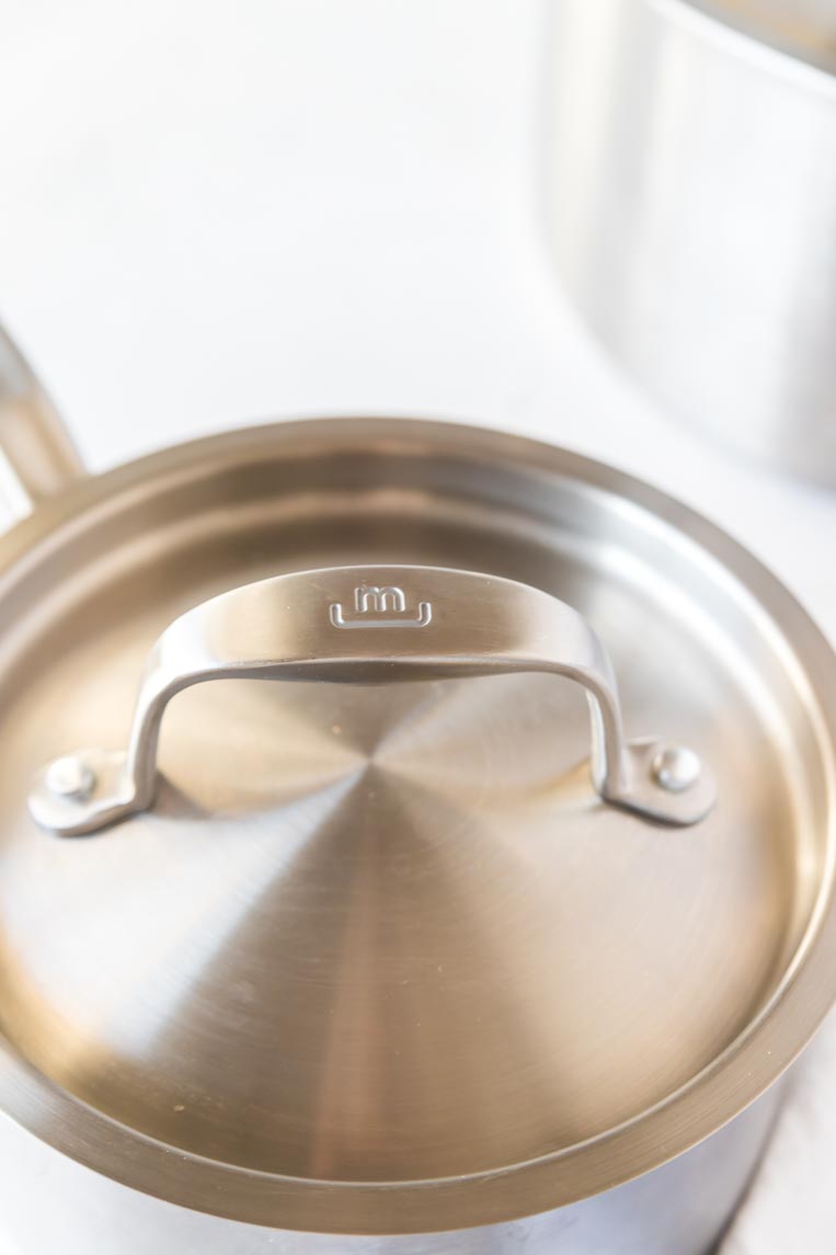 the lid of a stainless steel pot