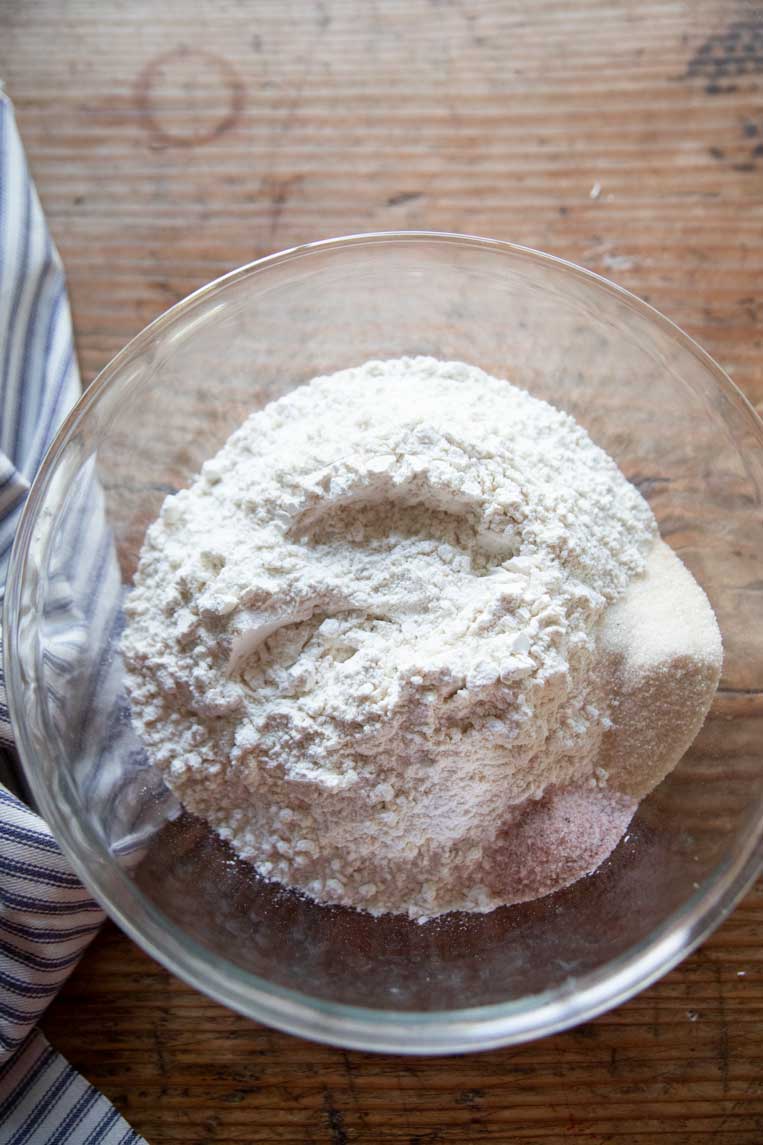 a bowl of flour with salt and sugar
