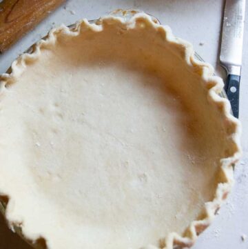 a pie shell with crust in it ready to be baked