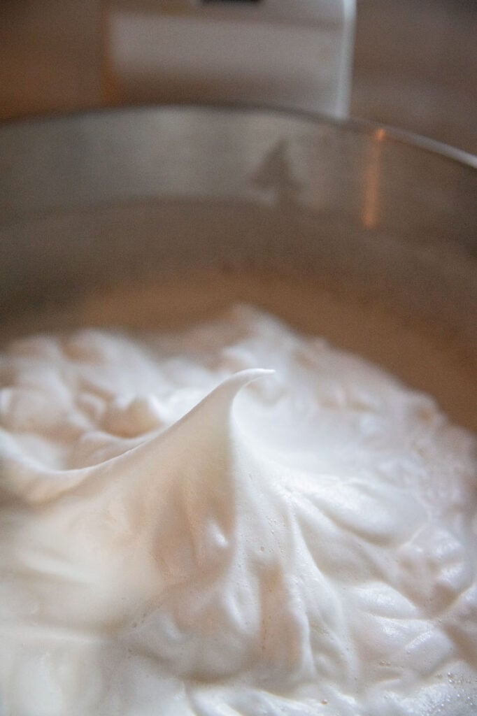 a bowl of egg whites with soft peaks 