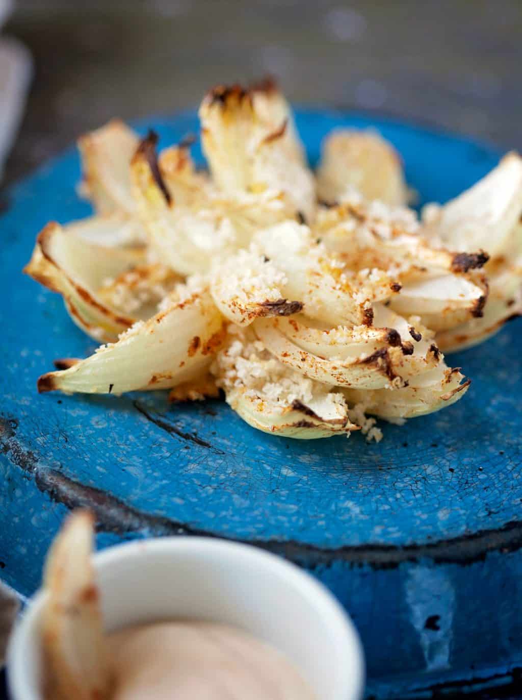 Baked blooming onions are a perfect oven to table appetizer or light dinner. Perfect at room temperature and lighter on calories than their fried version. 