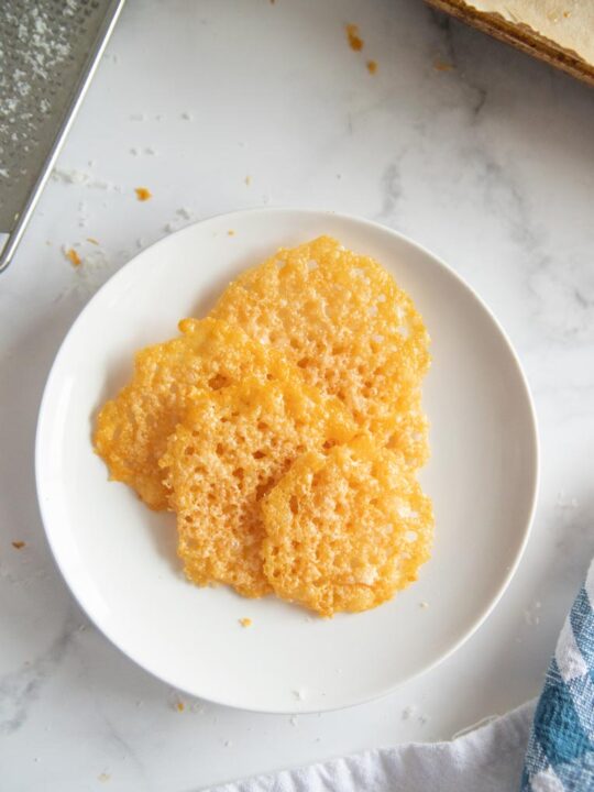 baked cheese crisps on a plate