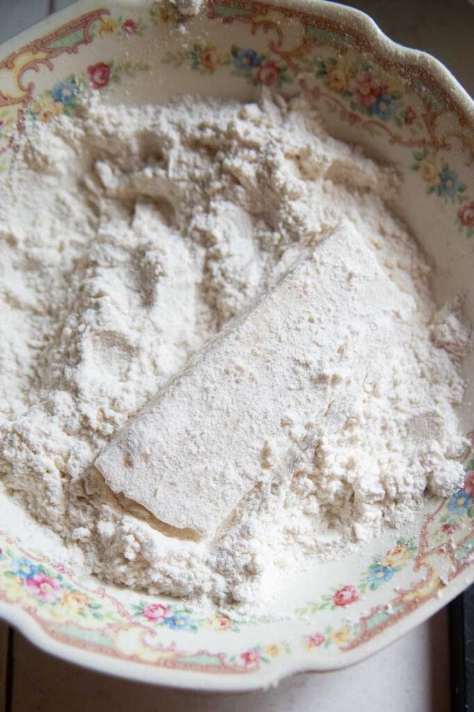 a stick of mozzarella in flour 