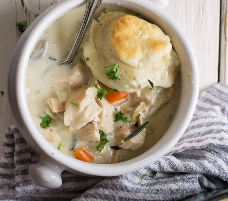 chicken and biscuit casserole in a white cup
