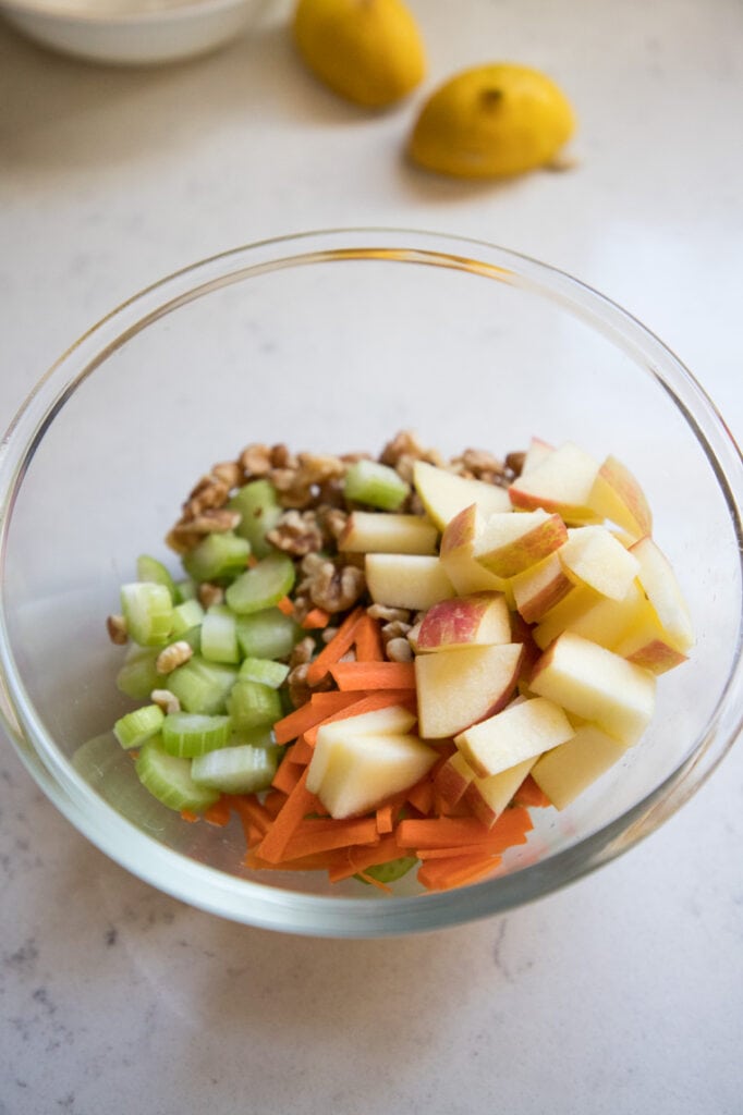 step one: dice apples, celery and walnuts in to bite size pieces for your waldorf salad