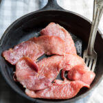 country ham slices in a cast iron skillet