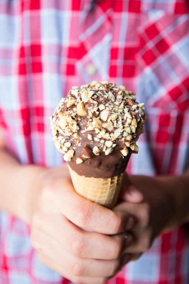 homemade drumstick ice cream cones being held by a child