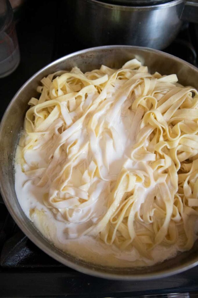 pasta, cream and butter in a skillet together before stirring