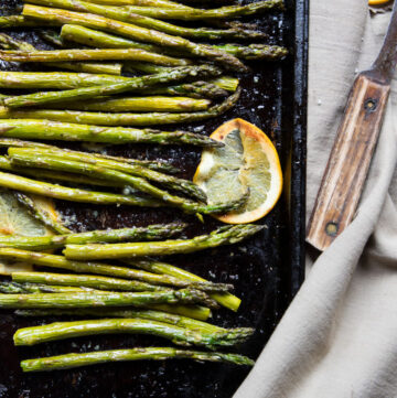 a sheet pan of roasted ginger and orange asparagus