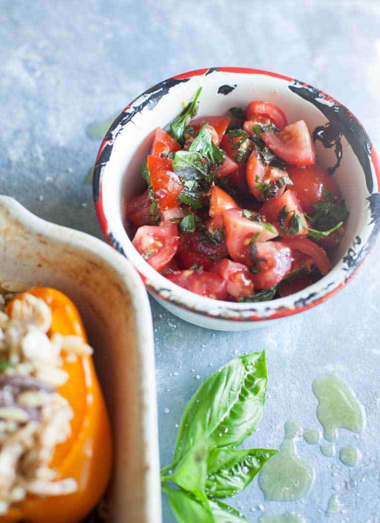 toss fresh tomatoes with olive oil, basil, salt and pepper for a fresh addition to your greek stuffed bell peppers