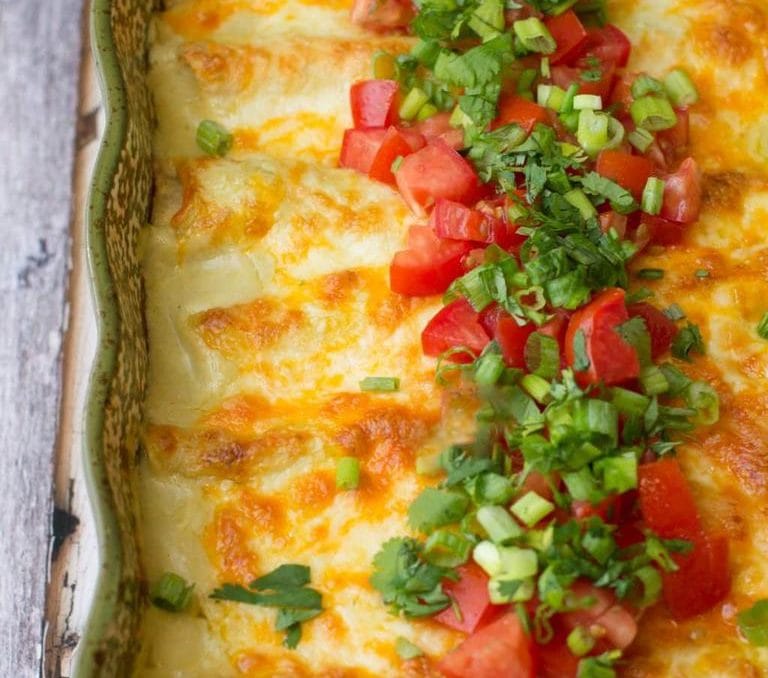 30-minute green chile chicken enchiladas can be made ahead if you're in a pinch and make a perfect weeknight dinner option.
