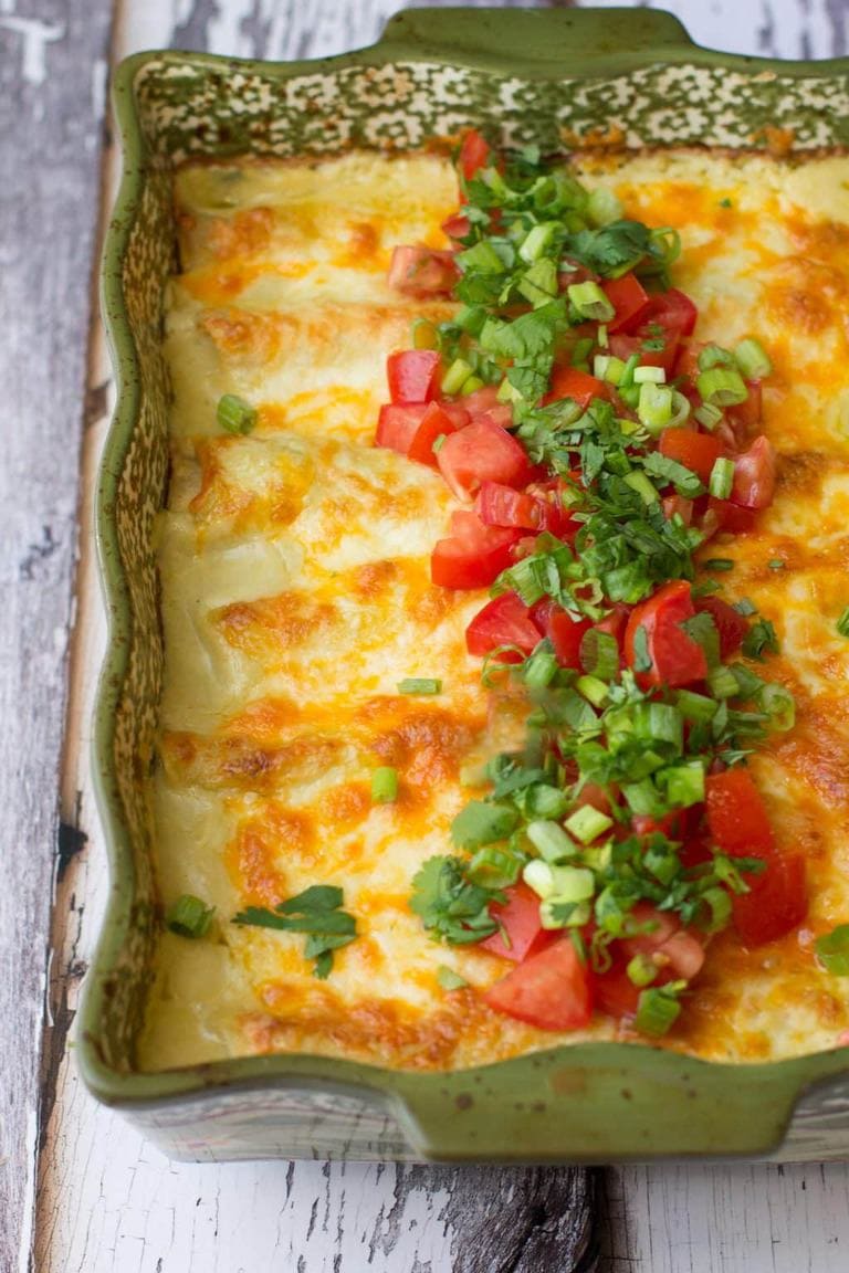 30-minute green chile chicken enchiladas can be made ahead if you're in a pinch and make a perfect weeknight dinner option.