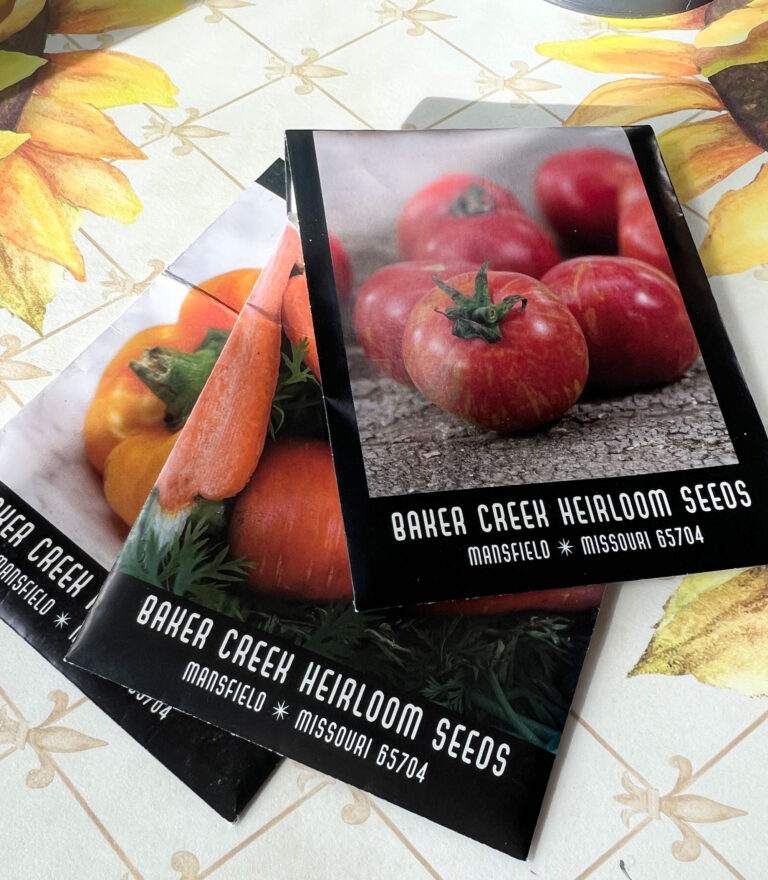 heirloom tomato seed packets on a table 