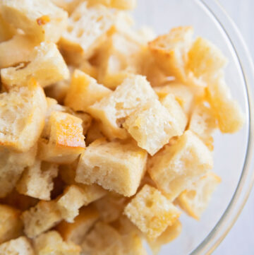 a bowl of golden brown croutons in a bowl