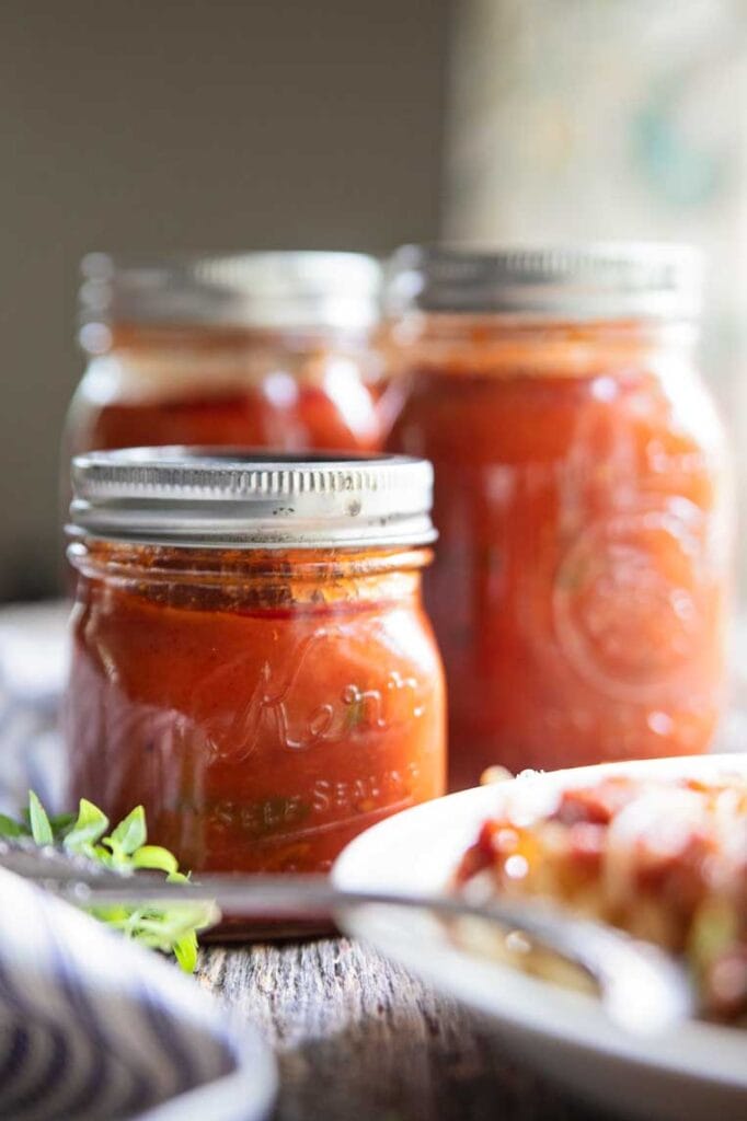 jars of canned pasta sauce on a table 
