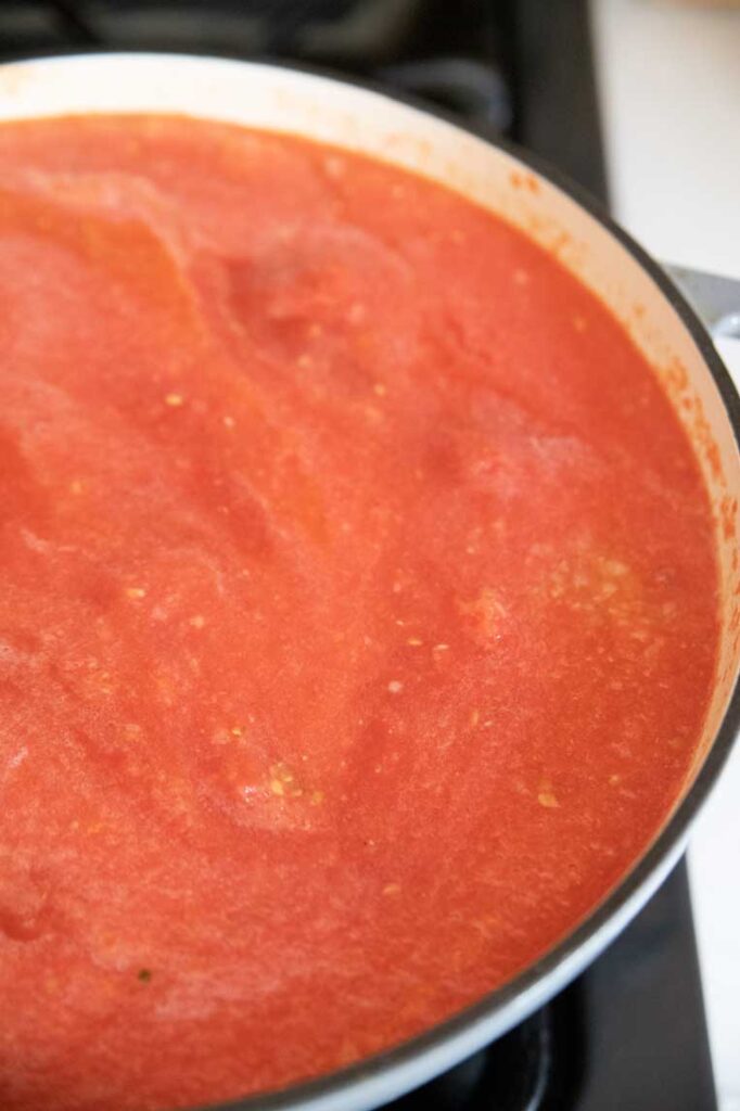 a big pot of tomatoes just added to the pot for pasta sauce 
