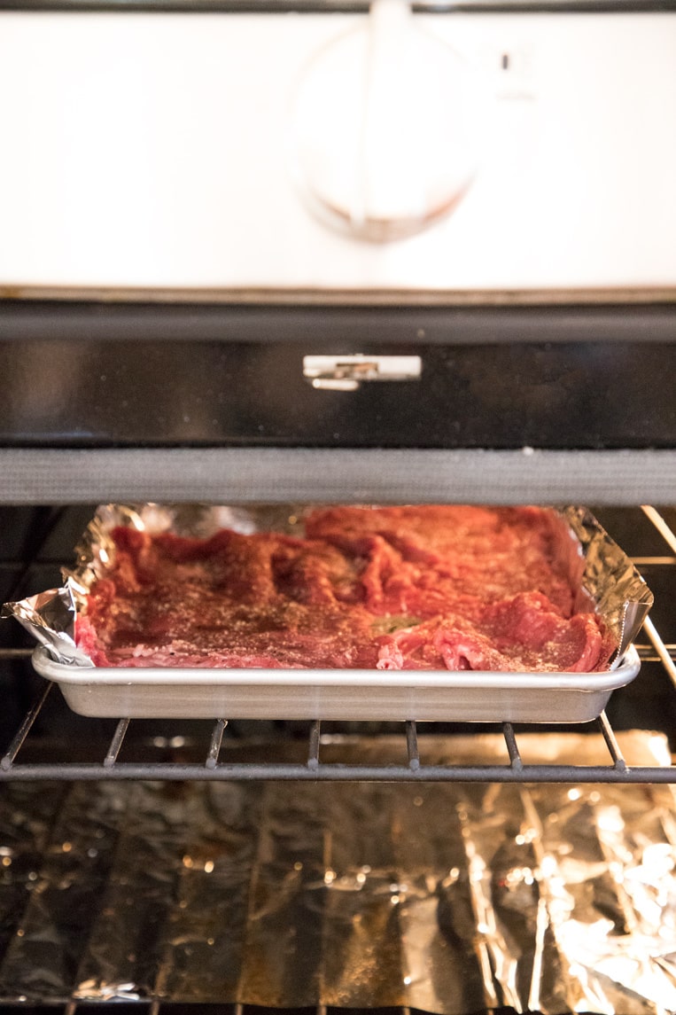 a skirt or flank steak placed in the oven on a  foil lined baking sheet