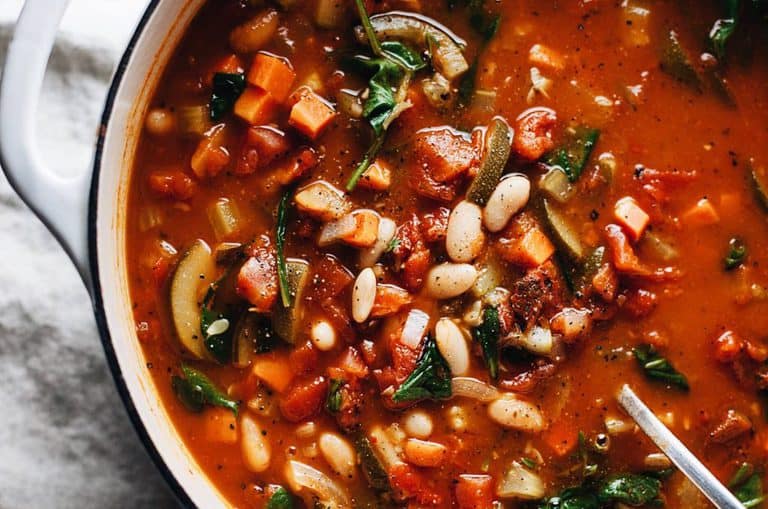 italian white bean and vegetable soup in a dutch oven