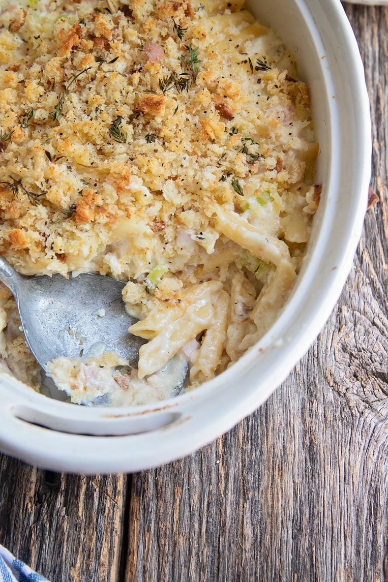 a dish of leftover turkey casserole with a scoop taken out 