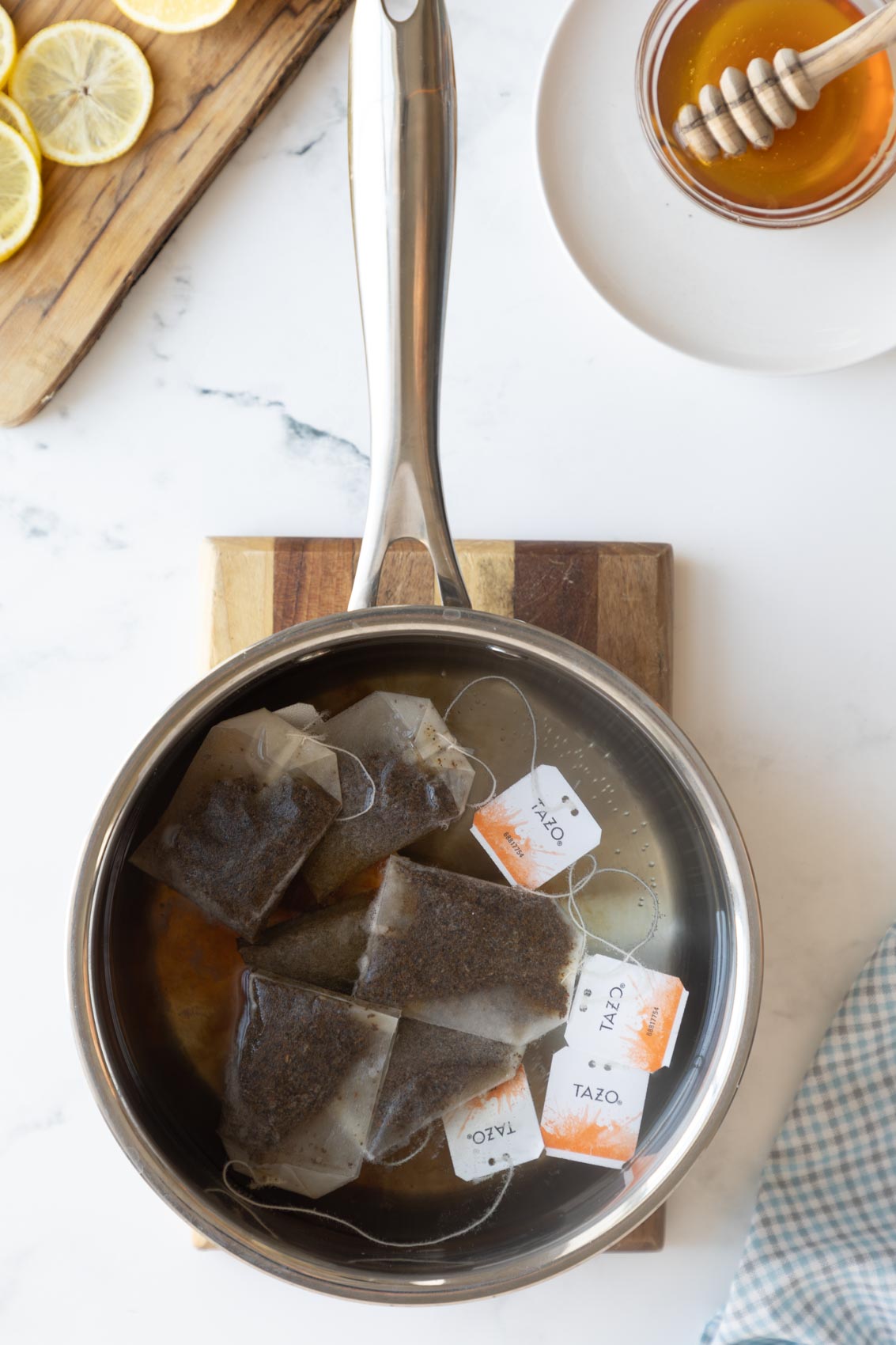 a pot with water and tea bags in the water 